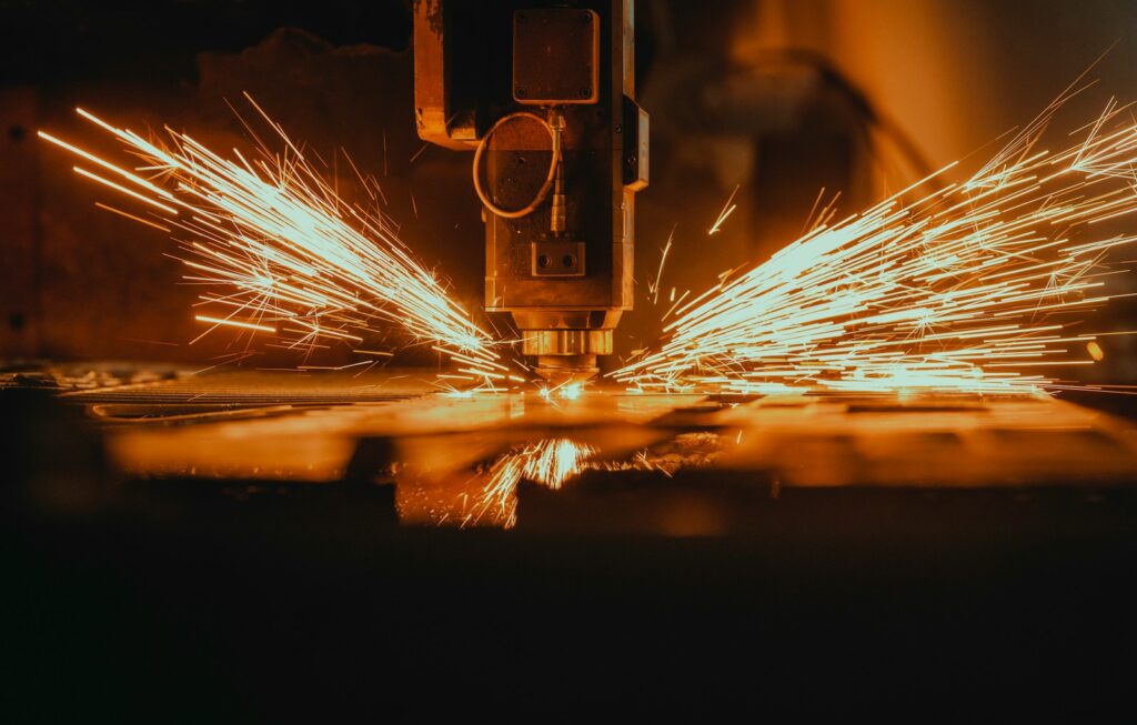 a piece of metal being cut with a machine